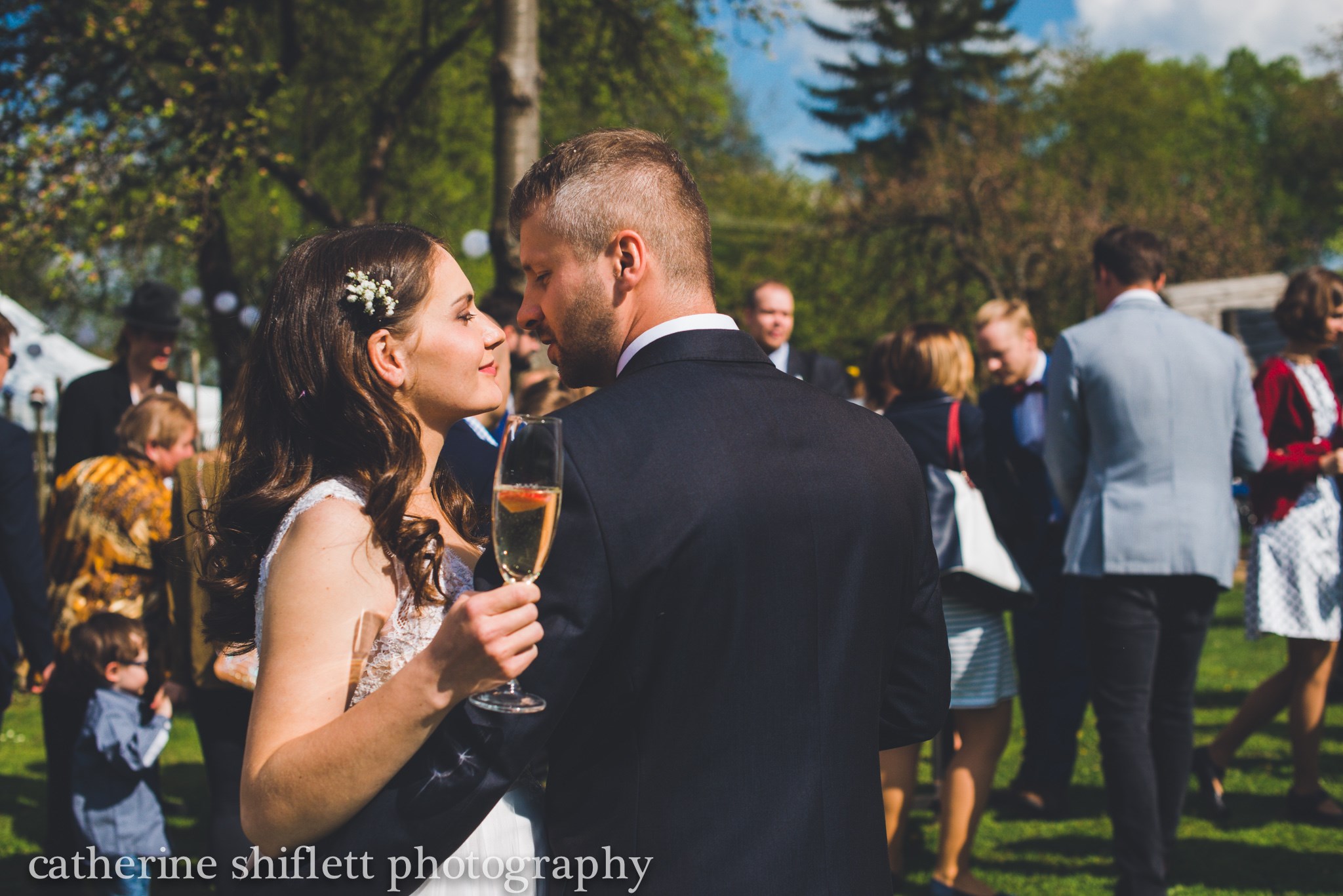 Catherine Shiflett Photography, wedding photography, candid of bride and groom sharing a moment, shot on Nikon D800